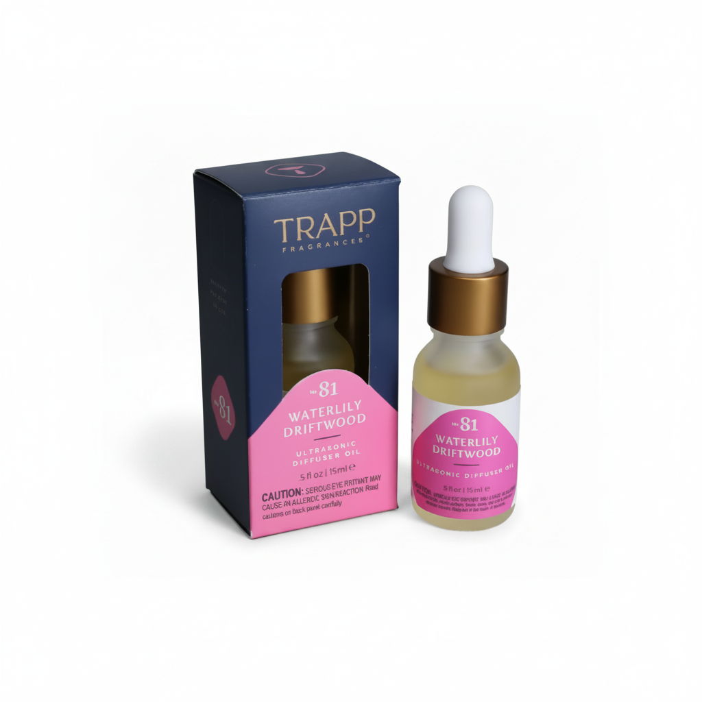 TRAPP Fragrances product packaging and a small glass bottle with a dropper containing ultrasonic diffuser oil labeled 'Waterily Driftwood'.